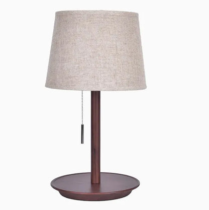 Walnut solid wood bedside lamp with fabric lampshade on wooden surface