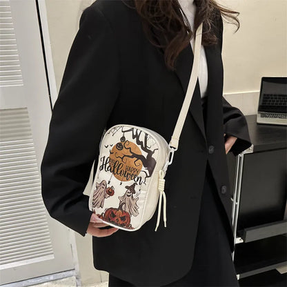 Halloween graffiti print crossbody bag in black with pumpkin, ghost, and bat designs, measuring 14x23x9.5cm
