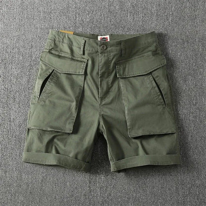 Men's straight-leg cargo shorts in Army Green with multiple pockets, showing micro-elastic cotton fabric detail