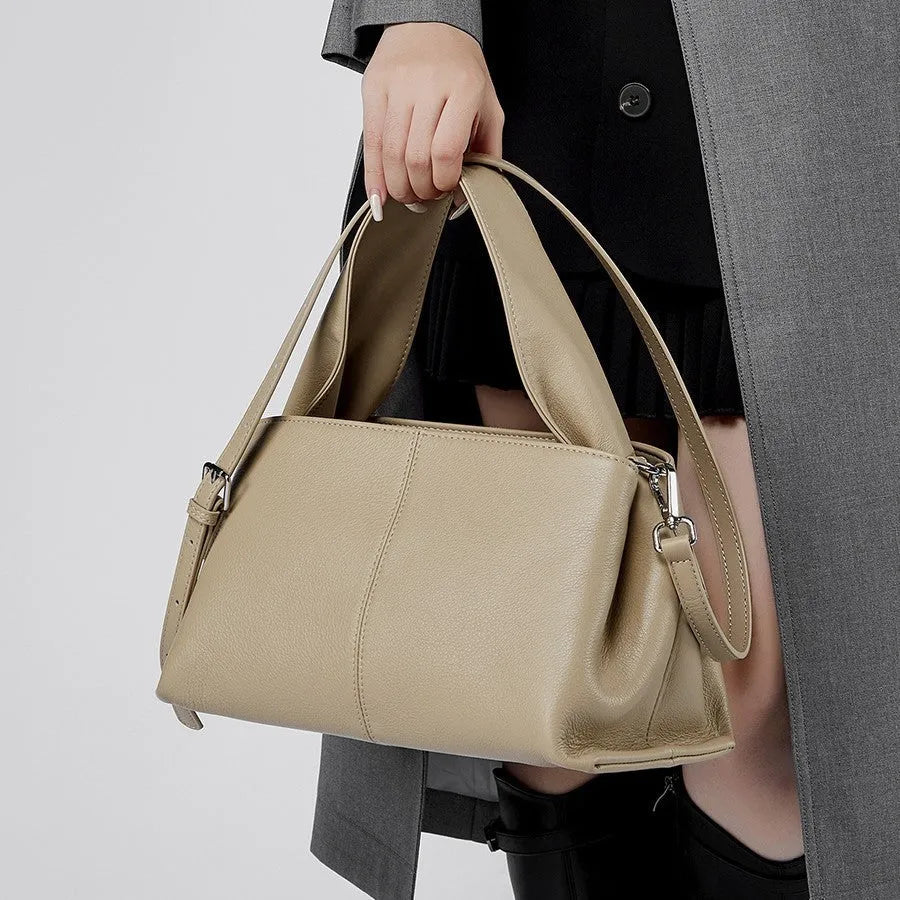 Women's genuine cowhide retro texture messenger bag in horizontal square shape, shown in apricot colour with double shoulder straps.