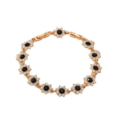 Floral shaped zinc alloy bracelet with electroplated colourful gem finishes in gold and silver tones.