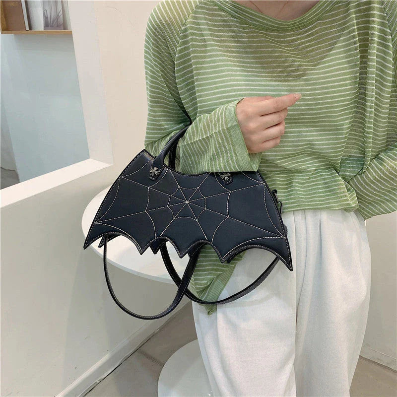 Stylish Halloween spider web crossbody bag in various colors, including black, white, brown, pink, and purple