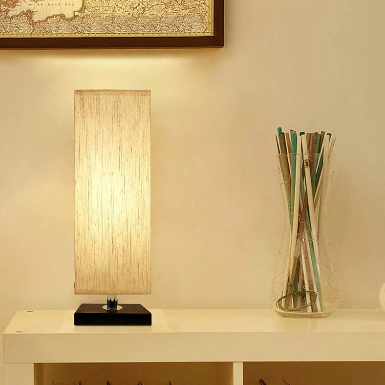Modern square table lamp with linen cloth cover and petal-shaped design measuring 10.5cm