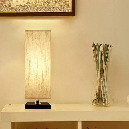 Modern square table lamp with linen cloth cover and petal-shaped design measuring 10.5cm