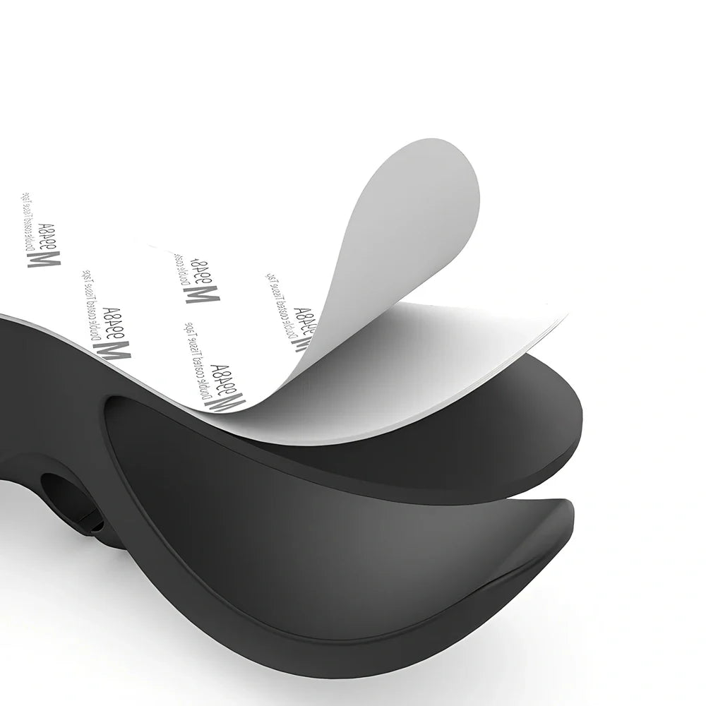 Black TPU cable organizer clips winding appliance cords on kitchen counter, 5cm size, non-marking adhesive for tidy management