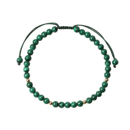 Women's malachite crystal bracelet with golden balls and handwoven design