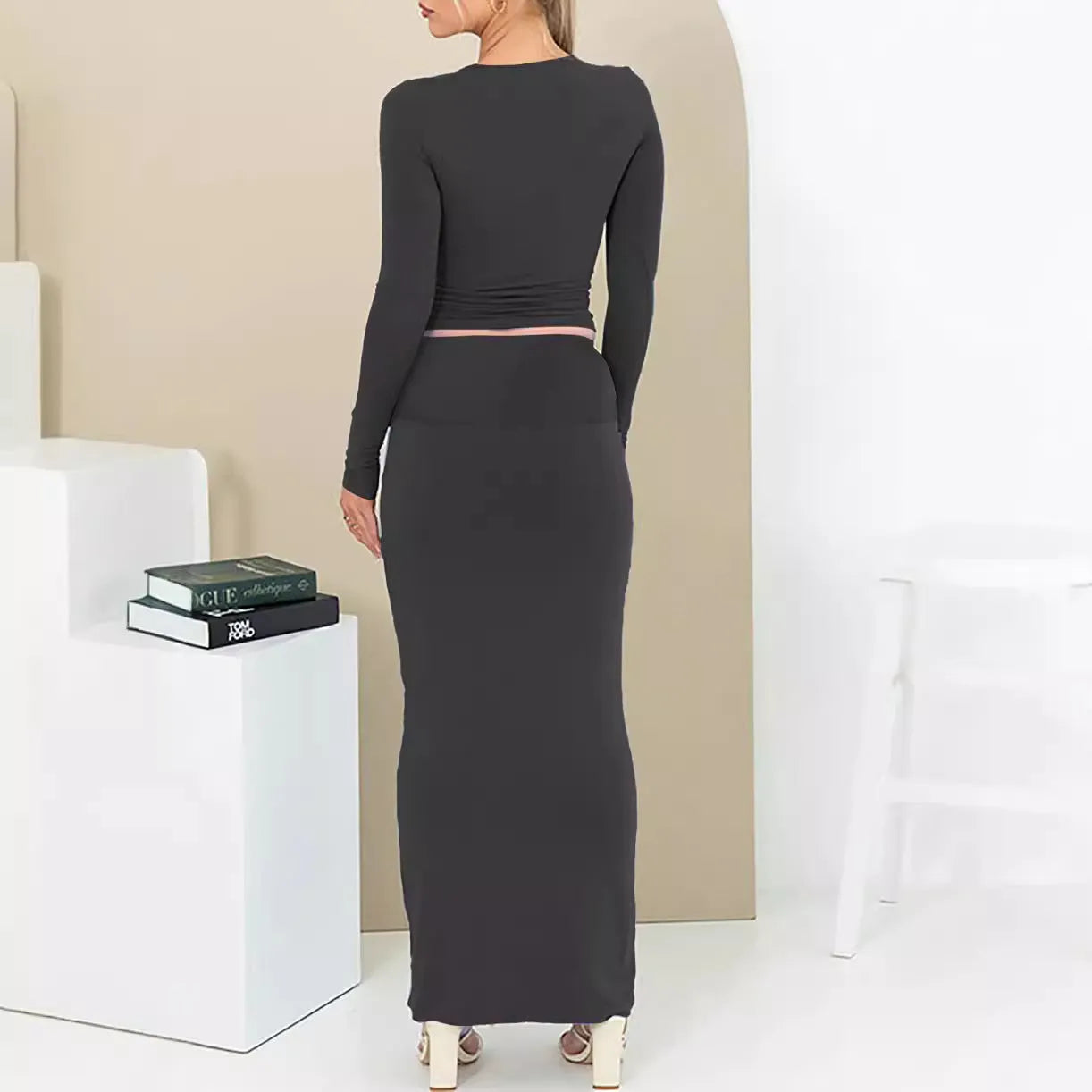 Women's black polyester two-piece suit with a sweet style, featuring a top and long skirt in a slim fit.
