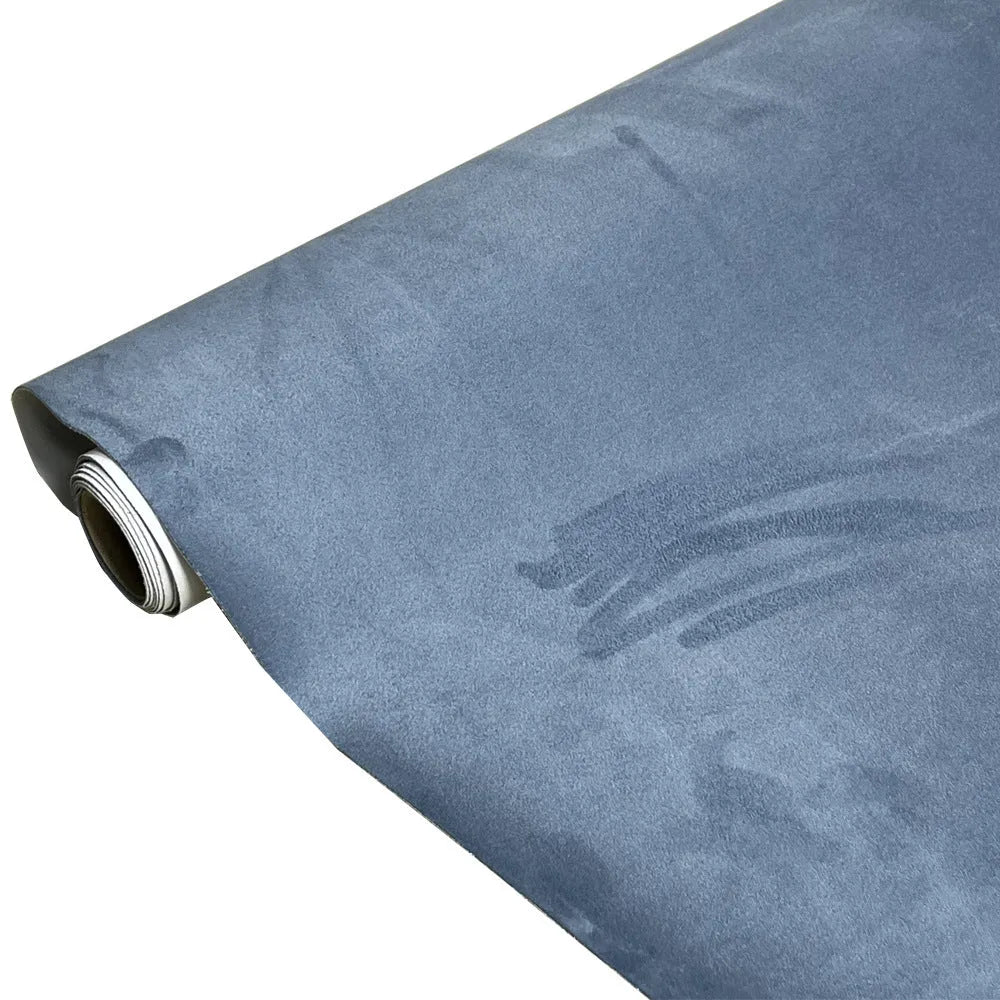 Rolls of self-adhesive leather suede in multiple colours showing texture and adhesive backing.