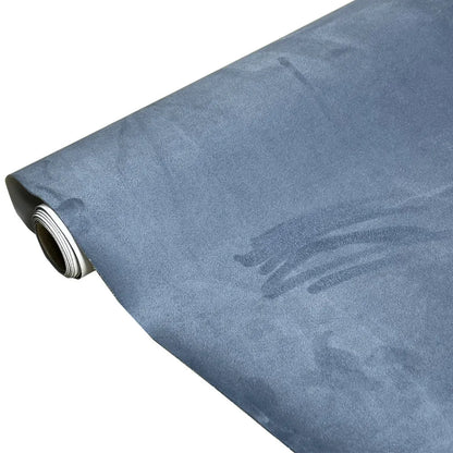 Rolls of self-adhesive leather suede in multiple colours showing texture and adhesive backing.