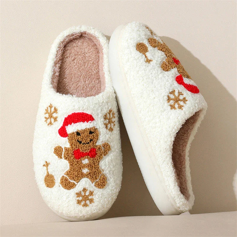 Cozy plush gingerbread slippers with festive snowflake patterns, designed for comfortable indoor wear during the winter season.