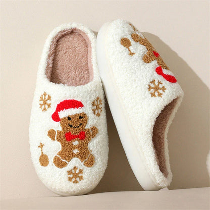 Cozy plush gingerbread slippers with festive snowflake patterns, designed for comfortable indoor wear during the winter season.