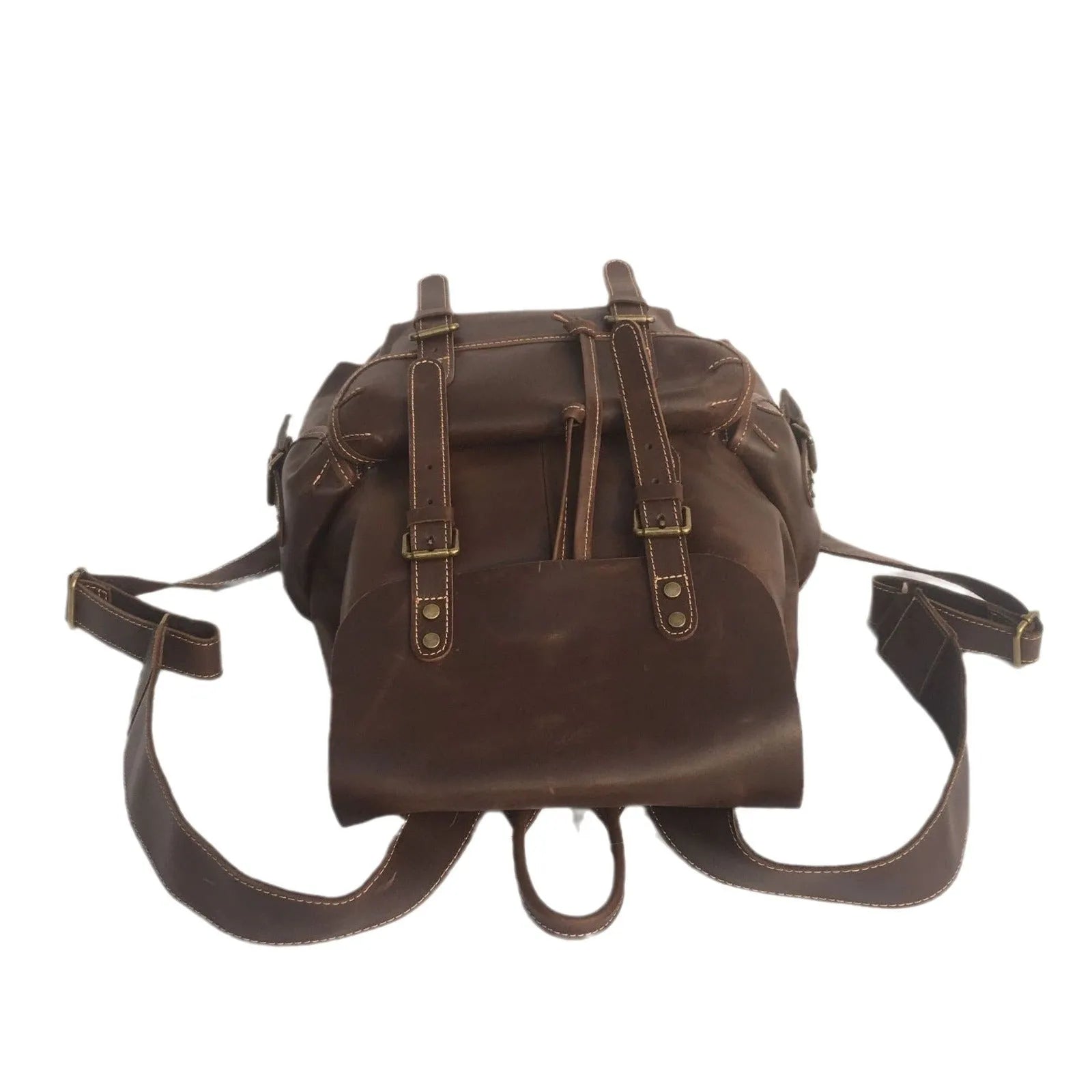 Men's brown leather backpack showing cowhide texture and air pillow belt system