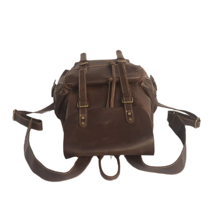 Men's brown leather backpack showing cowhide texture and air pillow belt system