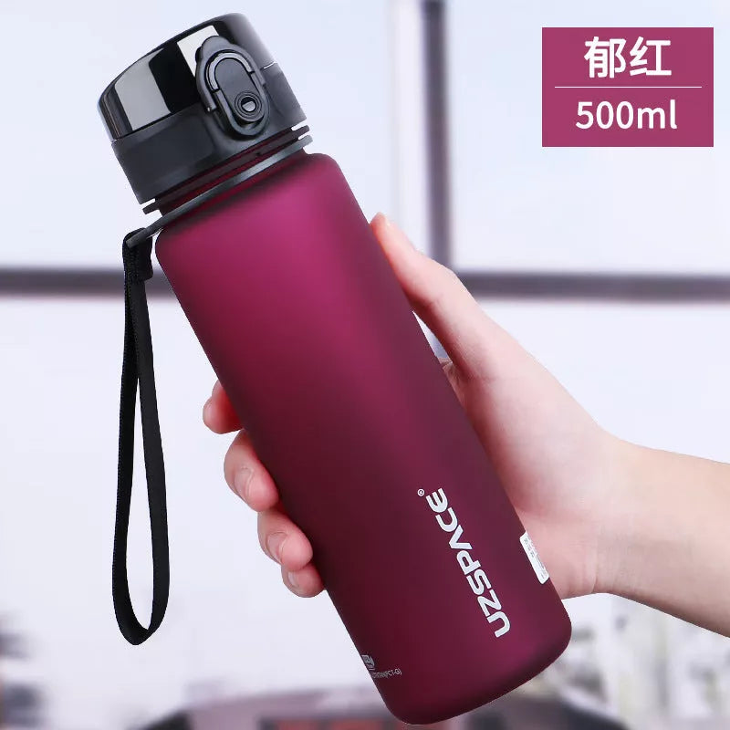 Large capacity Tritan sports water bottle in vibrant colors, perfect for hydration on the go