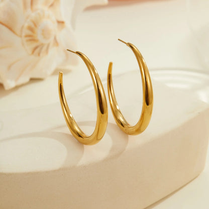 Women's stainless steel hoop earrings in two sizes with gold or steel finish