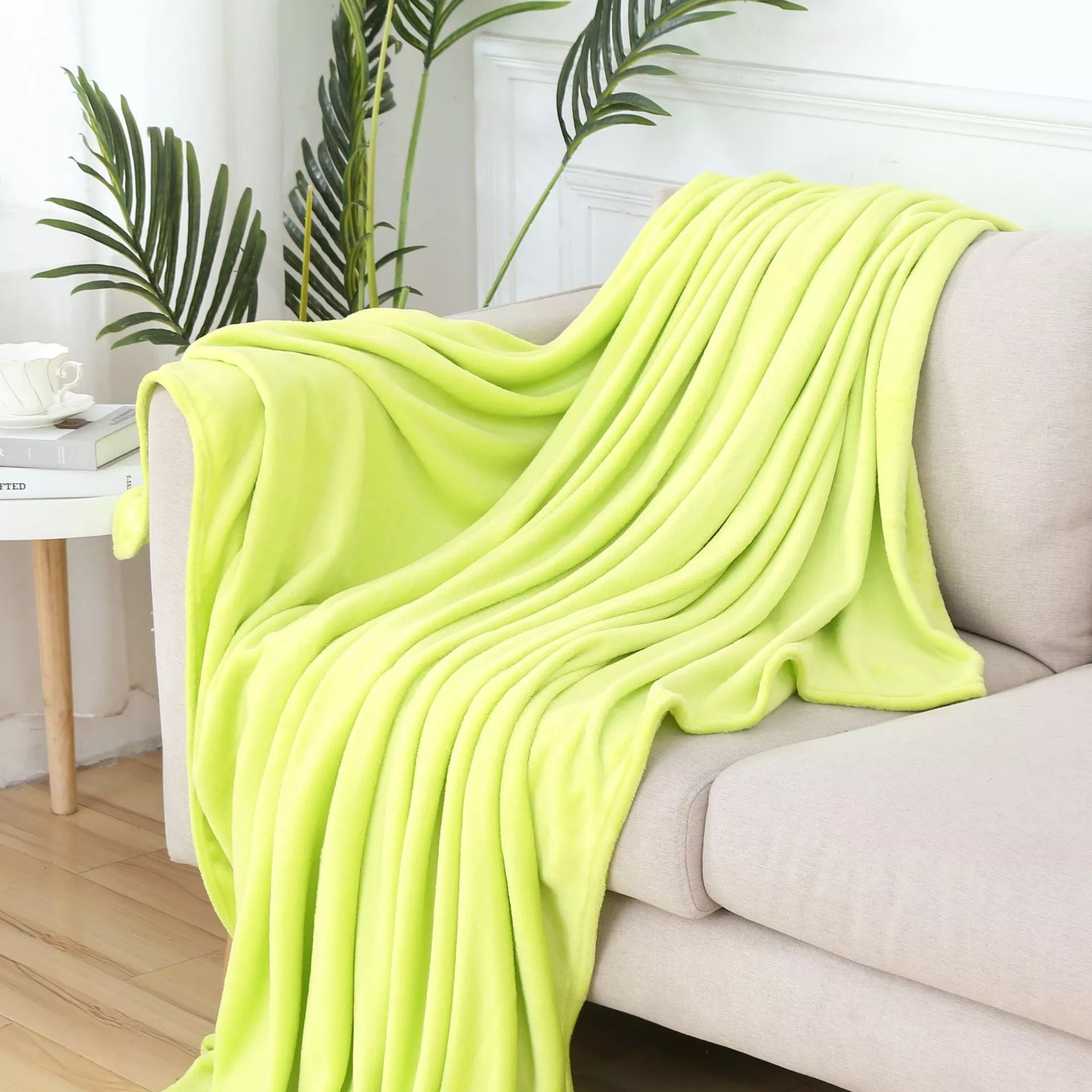 Solid color flannel blanket in various sizes and colors, made from durable polyester fiber
