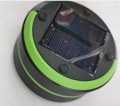 SolarBoom Collapsible Lantern with solar panel and USB charging port in green