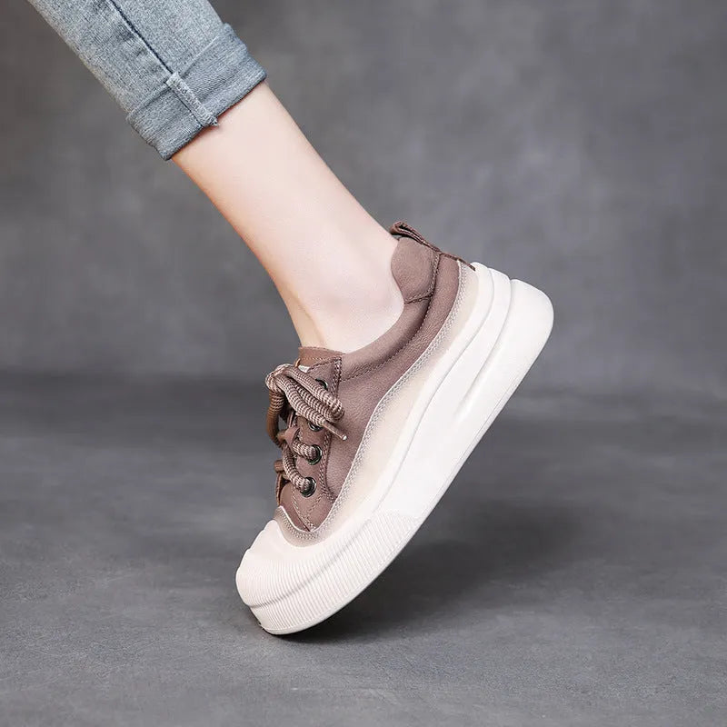 Women's brown leather lace-up casual shoes with round toe and rubber sole on white background
