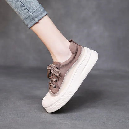 Women's brown leather lace-up casual shoes with round toe and rubber sole on white background