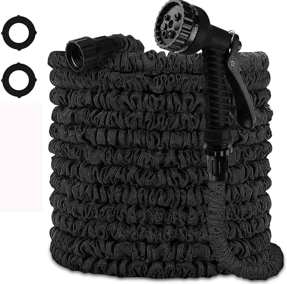 Expandable flexible water hose with spray gun showing green colour and extended length with water spraying in cone pattern