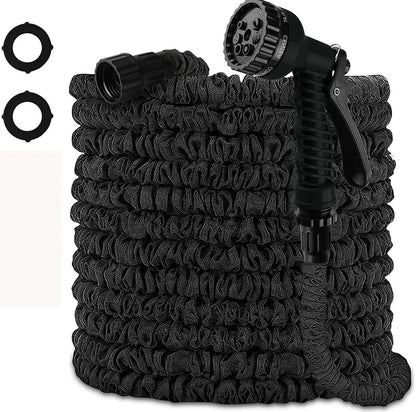 Expandable flexible water hose with spray gun showing green colour and extended length with water spraying in cone pattern