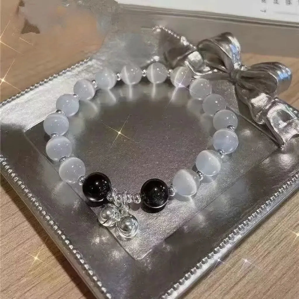 Handmade glass butterfly bracelet with drop-shaped beads in moonlight grey colour variation