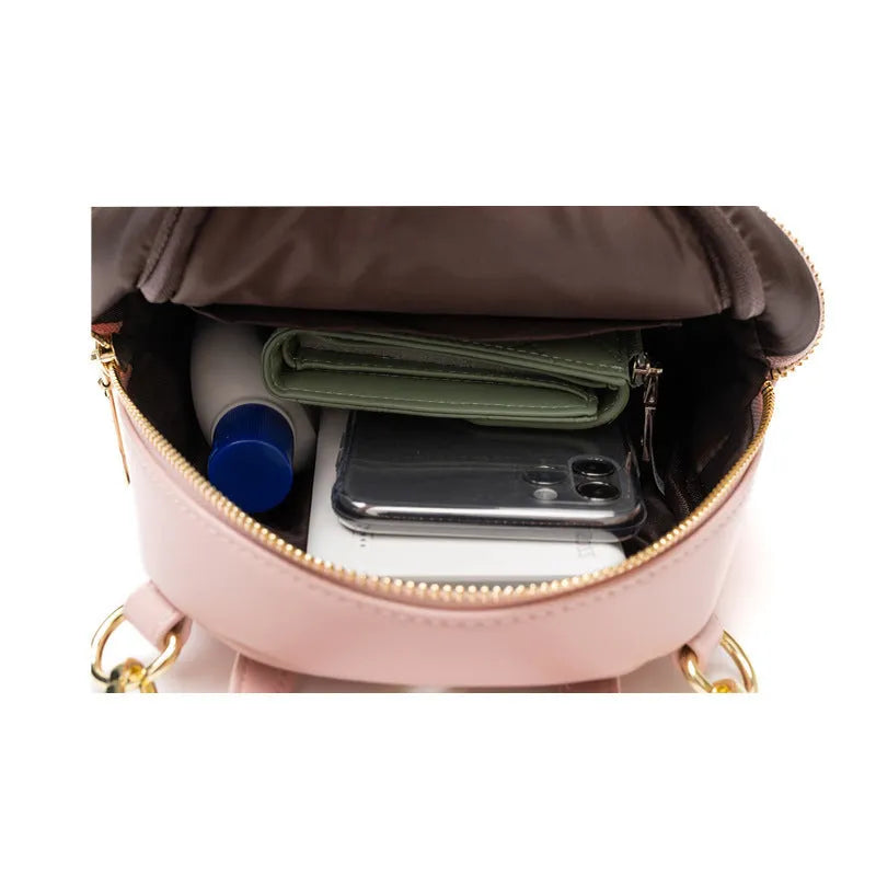 Soft PU mini backpack in multiple colours showing three-dimensional outer pockets and street style design.