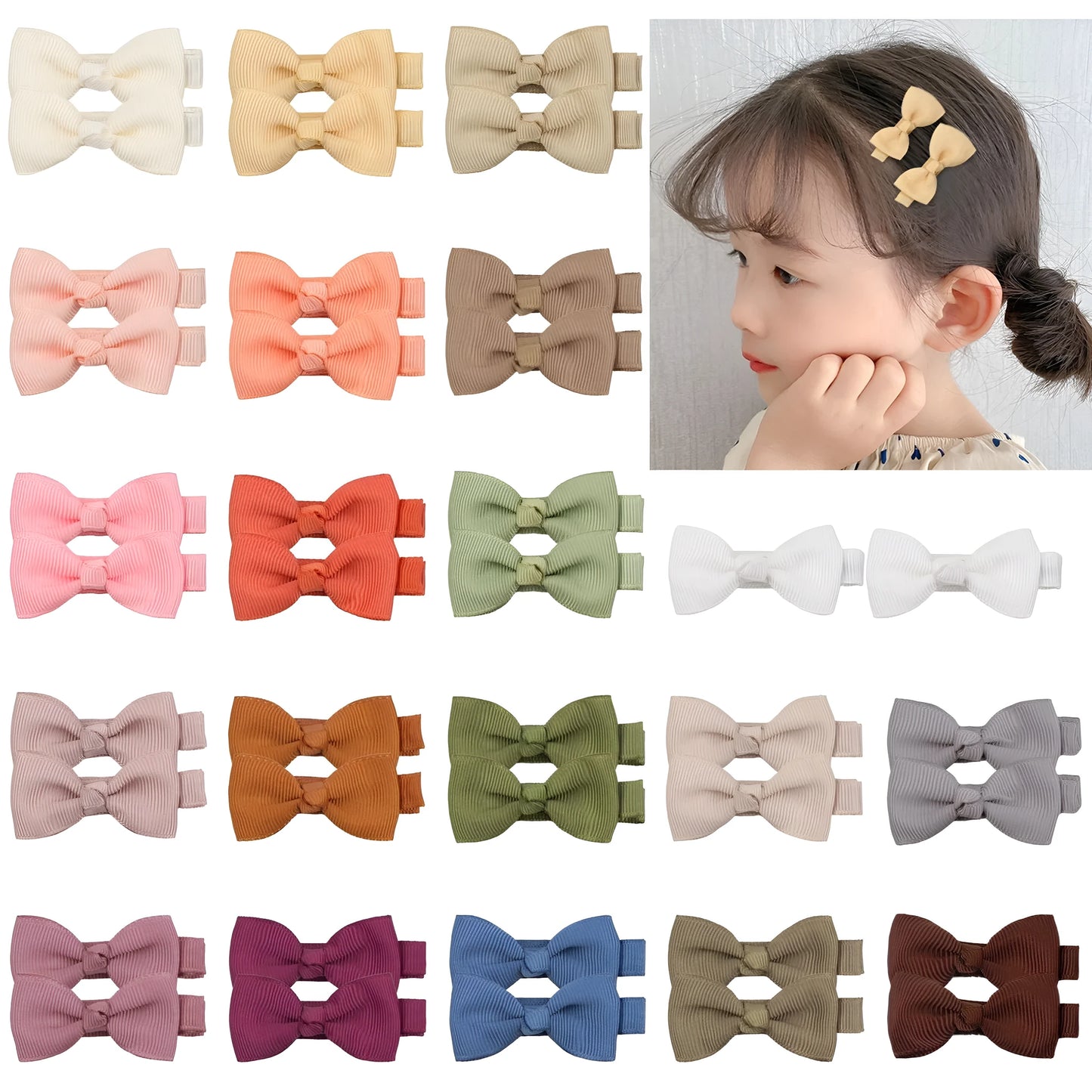 Assortment of pastel-coloured baby hair clips and bows arranged on a white background.
