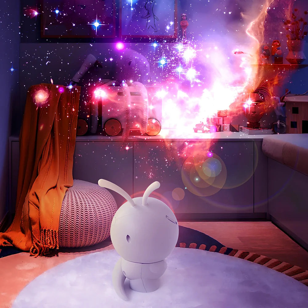 Grey ABS silicone galaxy projector showing rotating star projection on ceiling with USB cable