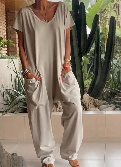 A stylish and comfortable oversized jumpsuit with roomy pockets, available in a variety of vibrant colors.
