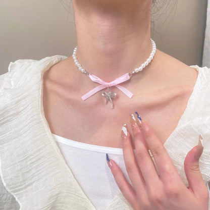 Love heart and bow tie clavicle chain necklace with pearl inlay, shown in White K Love 028 and White K Bow 026 options.
