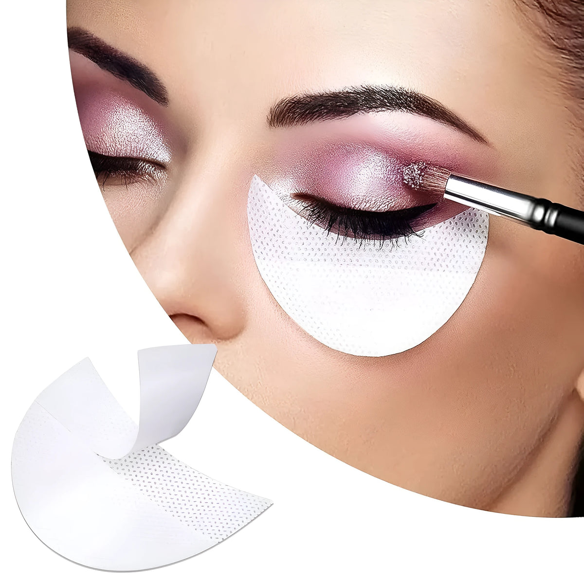 Pack of disposable half-moon shaped under-eye makeup shields on a pink background.
