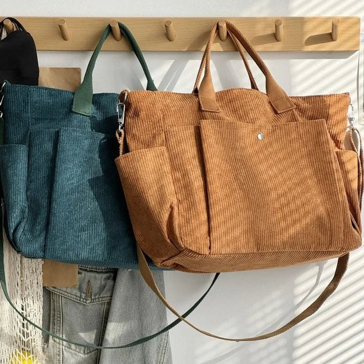 Adjustable corduroy messenger bag in various colors with zippered pocket