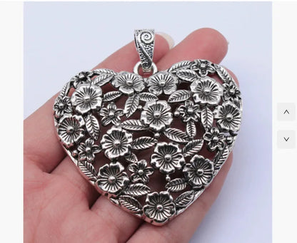Ancient silver hollow flower love alloy pendant measuring 67mm by 58mm