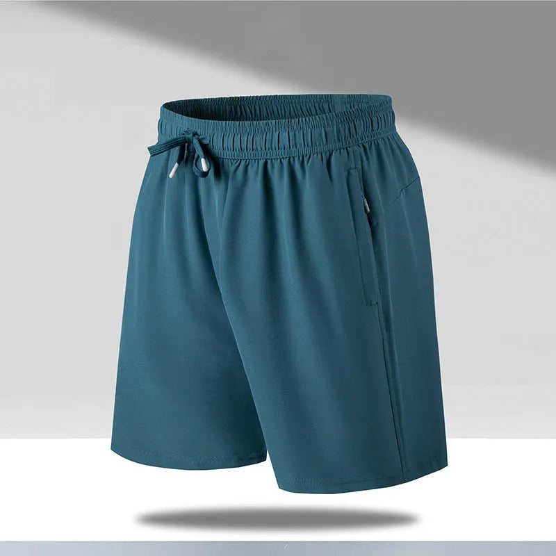 Man wearing black loose-fit ice silk sports shorts with a micro-elastic waistband, suitable for running or casual summer wear.