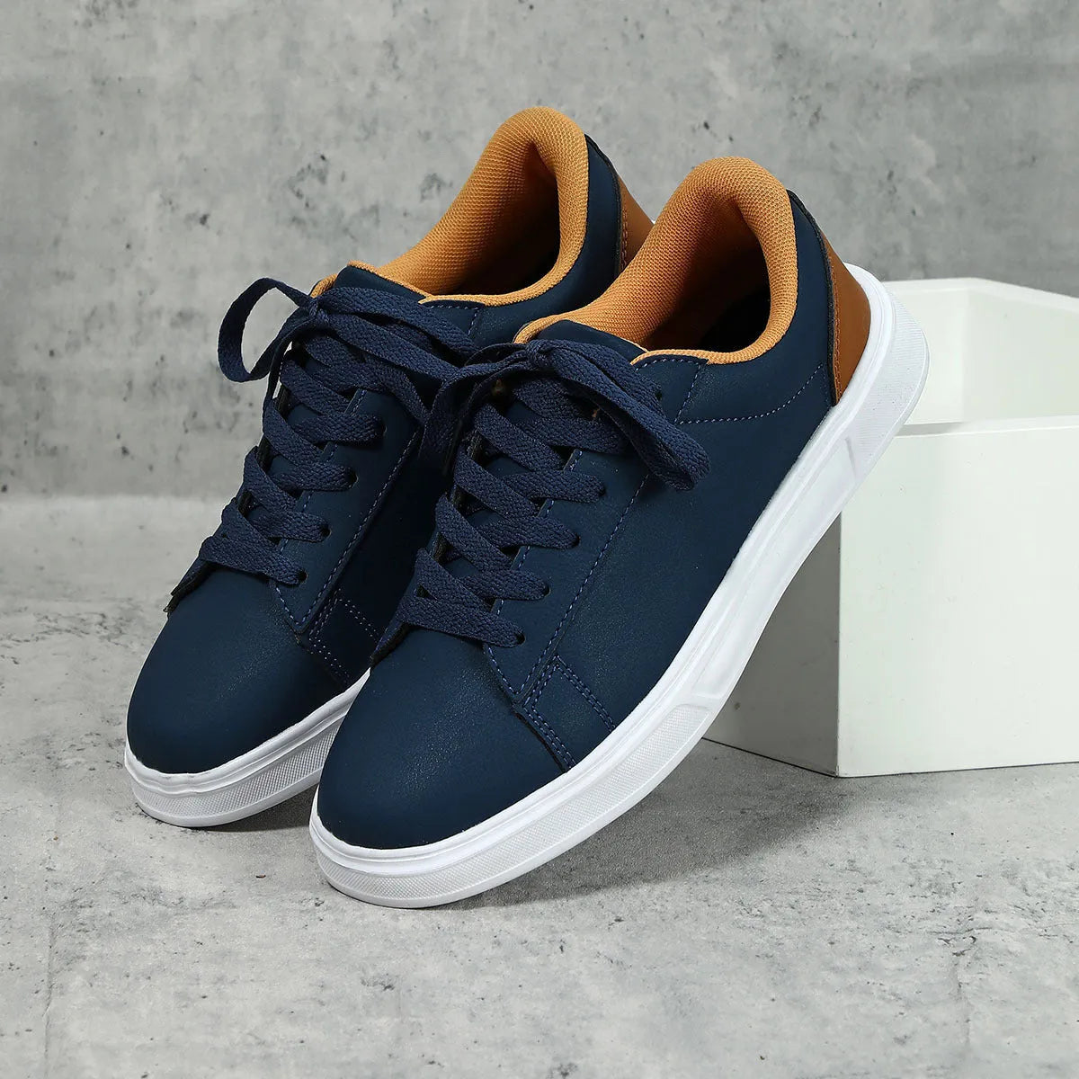 Beige brown women's low-top platform casual sneakers with a cross strap and round toe on a white background.