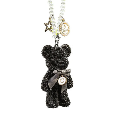 White artificial crystal rhinestone violent bear car rearview mirror pendant measuring 5x9cm.