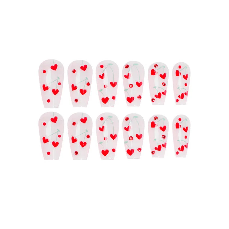 Sheet of 24 red diamond and cherry patterned nail art stickers with a small tube of adhesive glue.