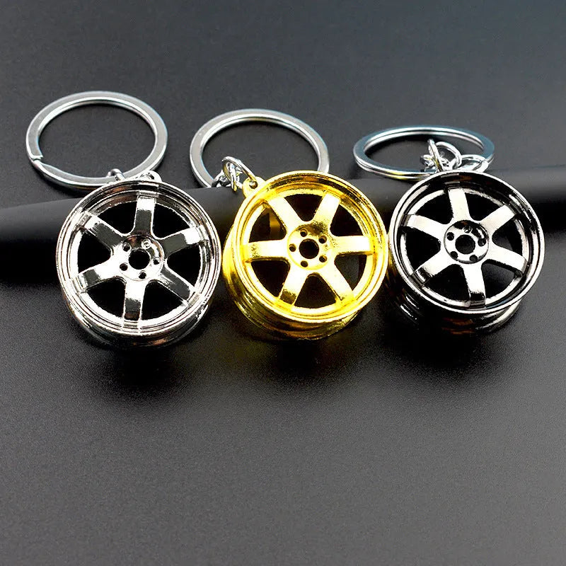 Zinc alloy car wheel hub keychain in black, gold and silver colour options
