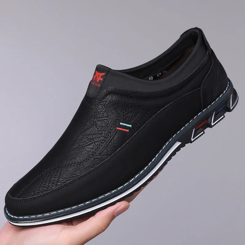 Men's black leather casual shoes with a leather toe cap and rubber sole on a white background.