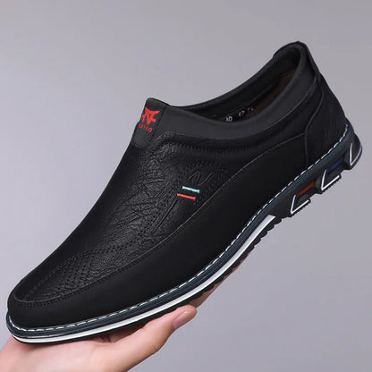Men's black leather casual shoes with a leather toe cap and rubber sole on a white background.