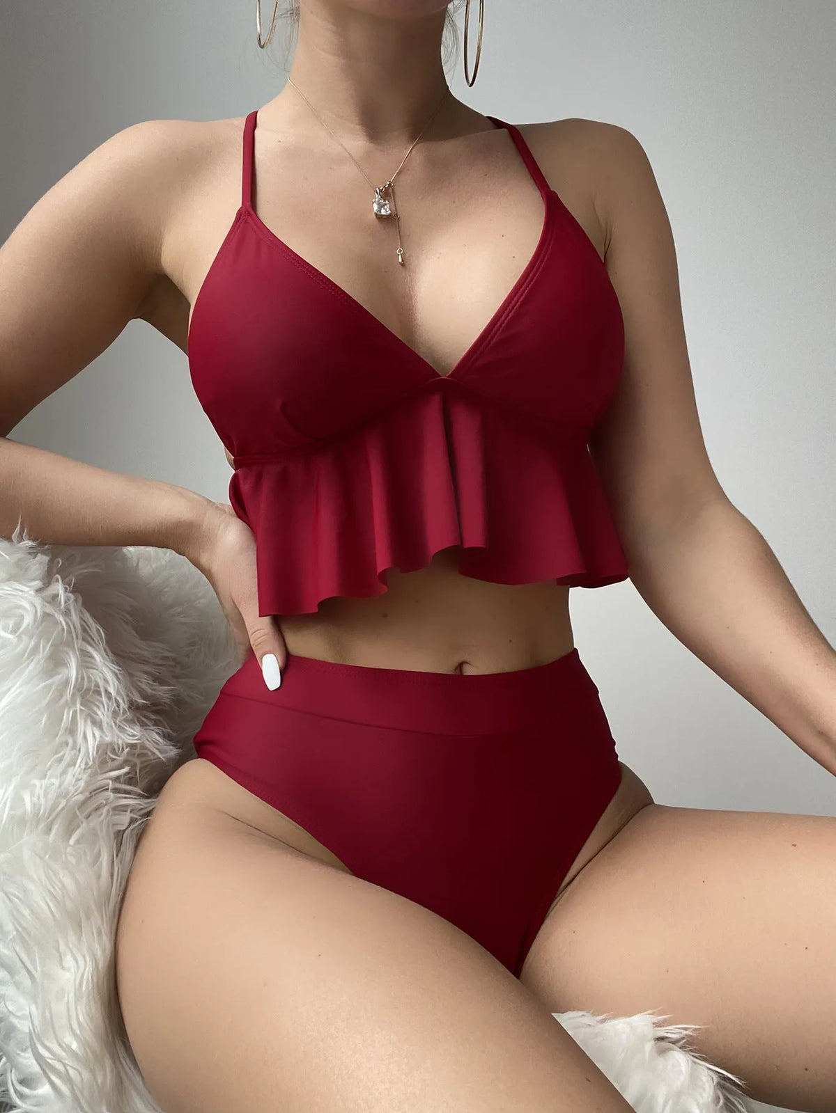 Women's solid colour split bikini swimsuit in black, green, red, or blue.