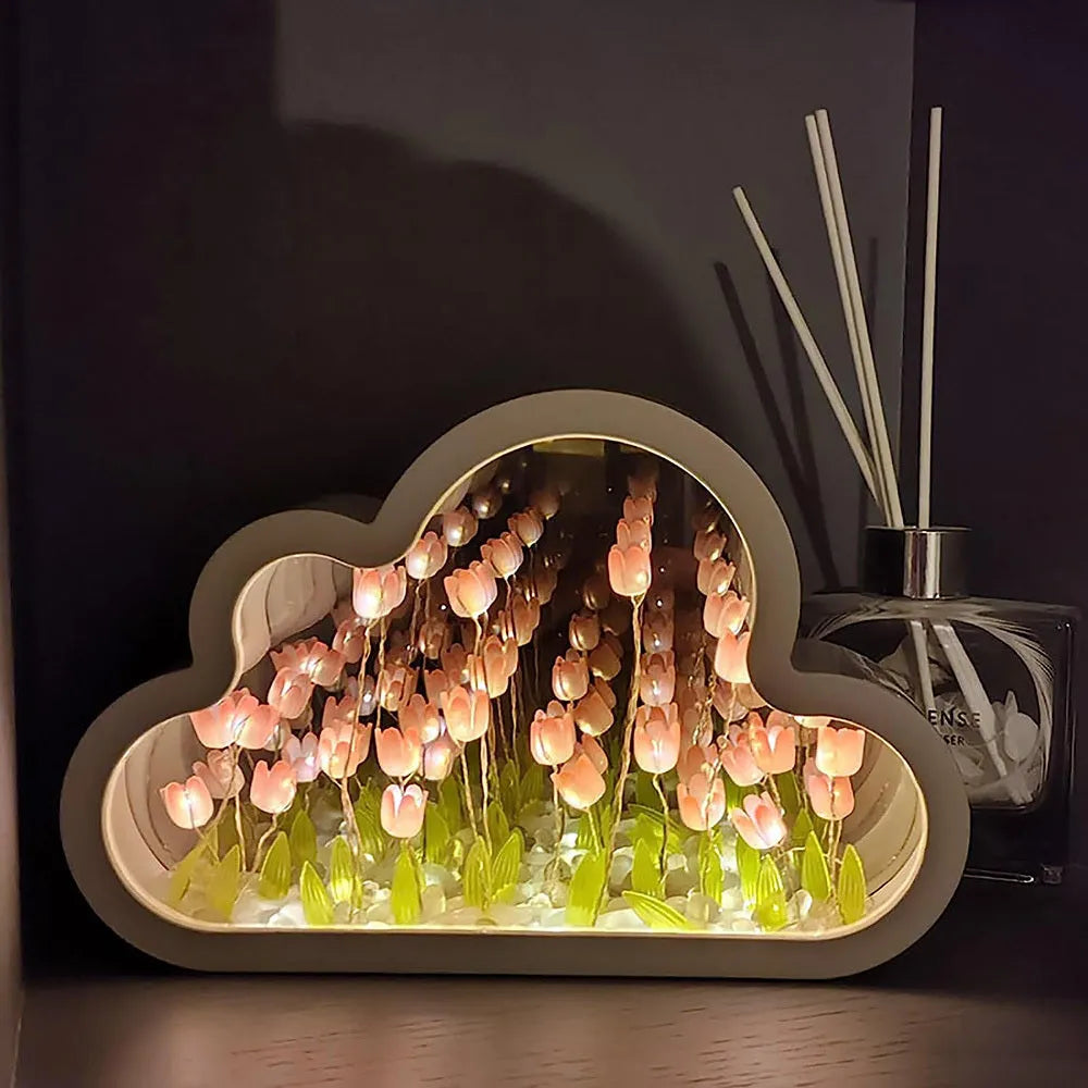 DIY tulip-shaped night lamp kit with LED lights and mirror surface in assorted colours on a desk.