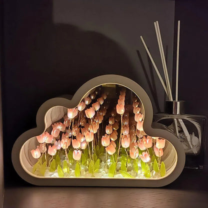 DIY tulip-shaped night lamp kit with LED lights and mirror surface in assorted colours on a desk.