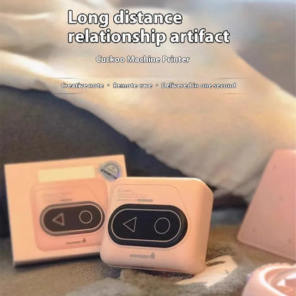 Compact Avocado Green mini Bluetooth thermal printer with mobile phone, thermal paper roll, and charging cable.