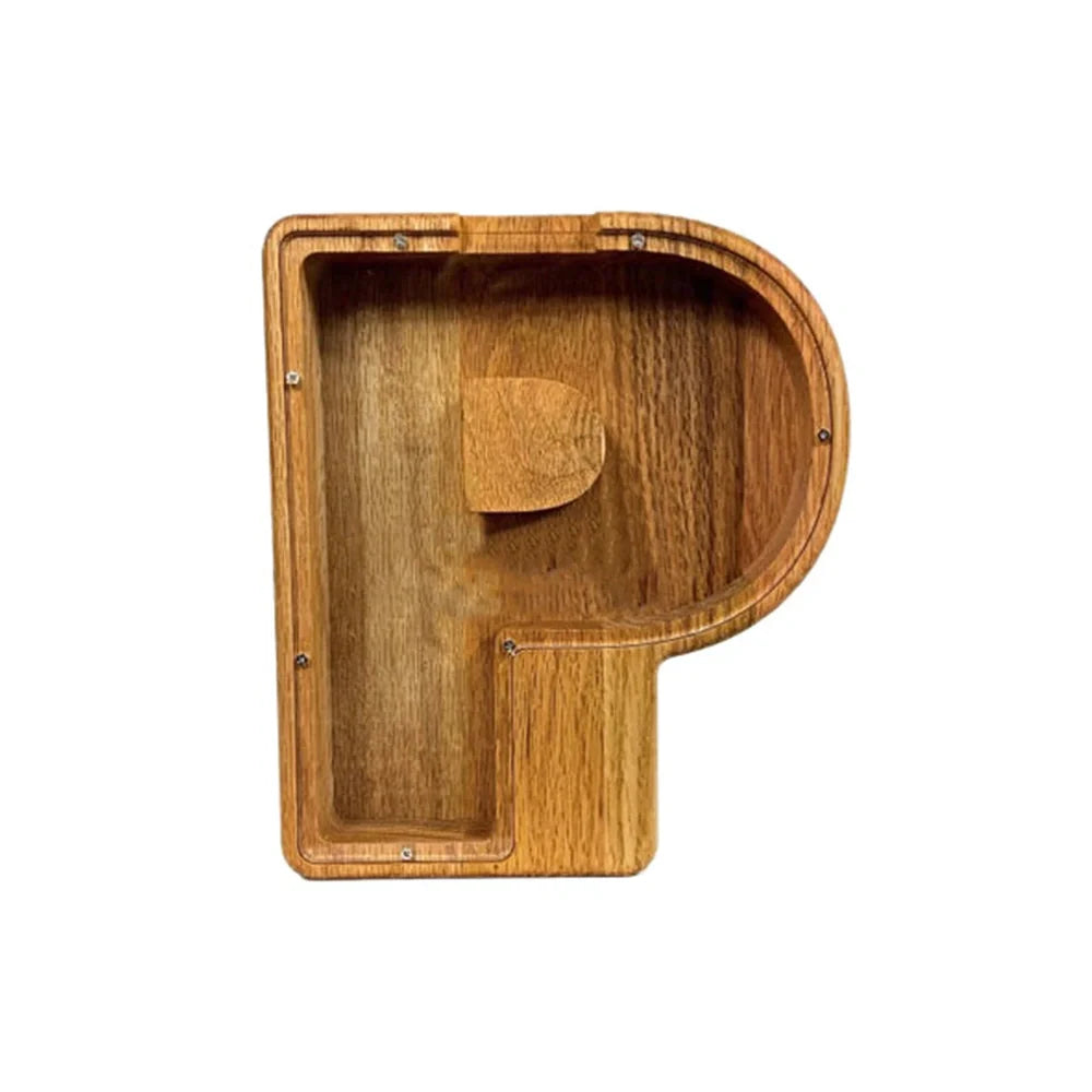 Handmade wooden letter piggy bank with personalised initial, showing 15cm height and 5cm coin slot for UK coins