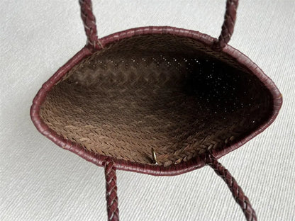 Brown woven cowhide leather tote bag with three-dimensional pocket, shown with dimensions 27cm by 30cm