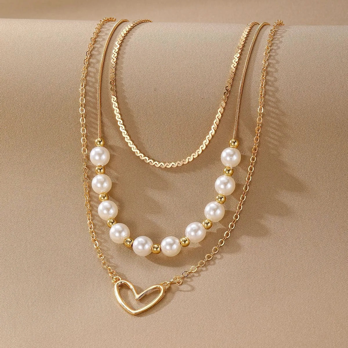 Vintage gold heart pendant necklace on a textured pearl chain, adjustable 41-50cm length.