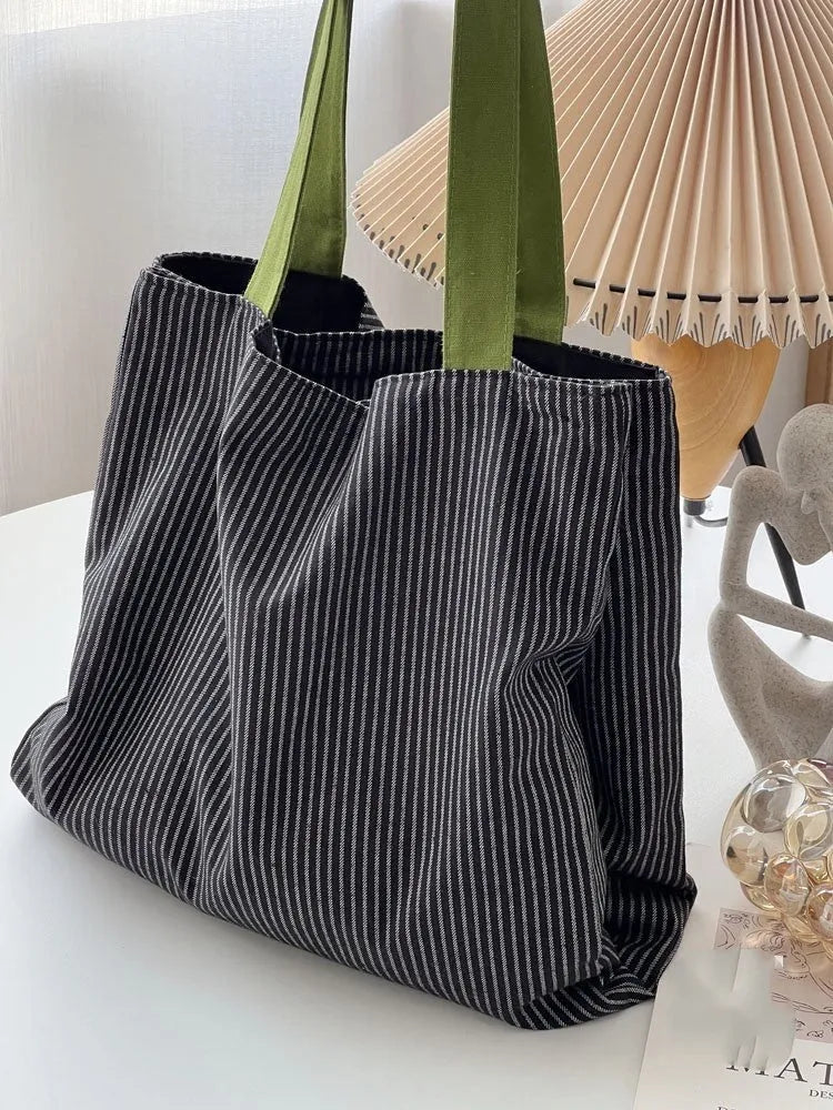 Light pink striped cotton canvas multi-layer tote bag with a wide shoulder strap.