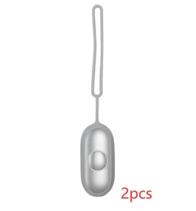 Hand-held micro-current sleep aid device in grey, green, and orange colour options